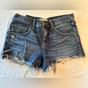 Classic Free People blue jean cut off shorts.